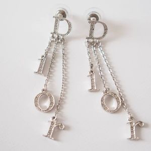 Christian Dior dangling letter earrings